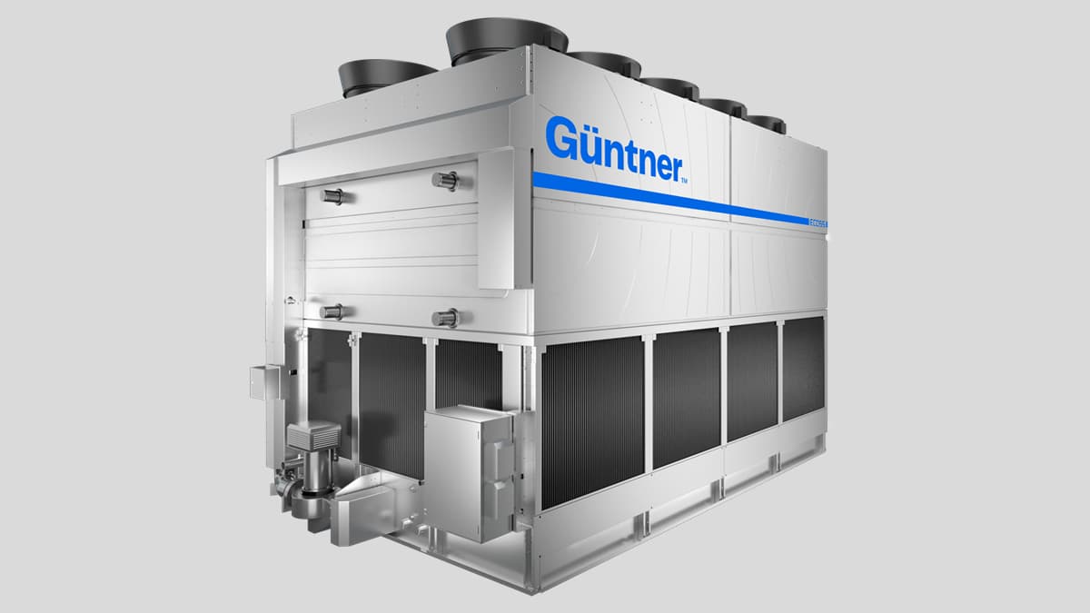 Large silver industrial chiller unit with top-mounted fans, side heat exchangers, and a blue Güntner logo against a light background.