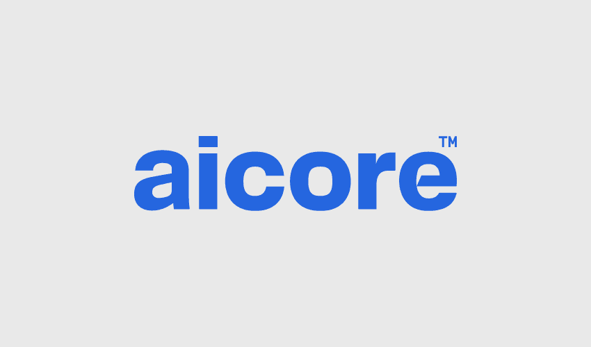淡灰色背景上的蓝色商标文字 aicore，粗体无衬线字体，右上角带有 TM 标记。