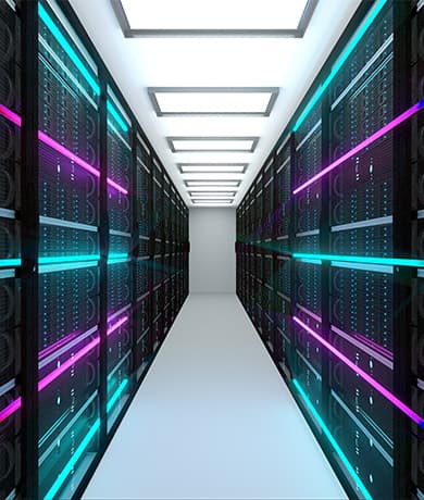 A data center aisle between rows of server racks, glowing cyan and magenta neon lights, white floor, and a bright panel-lit ceiling.