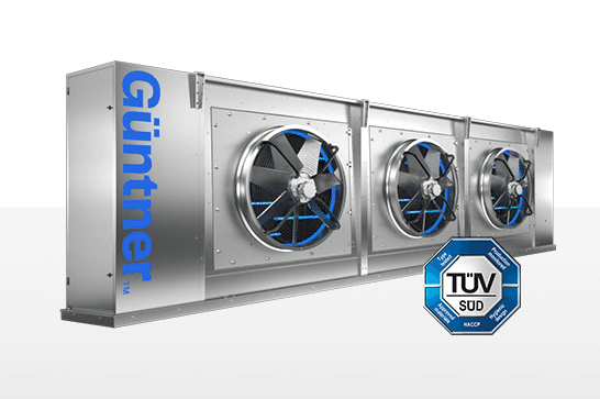 Industrial Guntner stainless-steel HVAC unit with three front fans, blue accents, and a TÜV SÜD certification emblem.