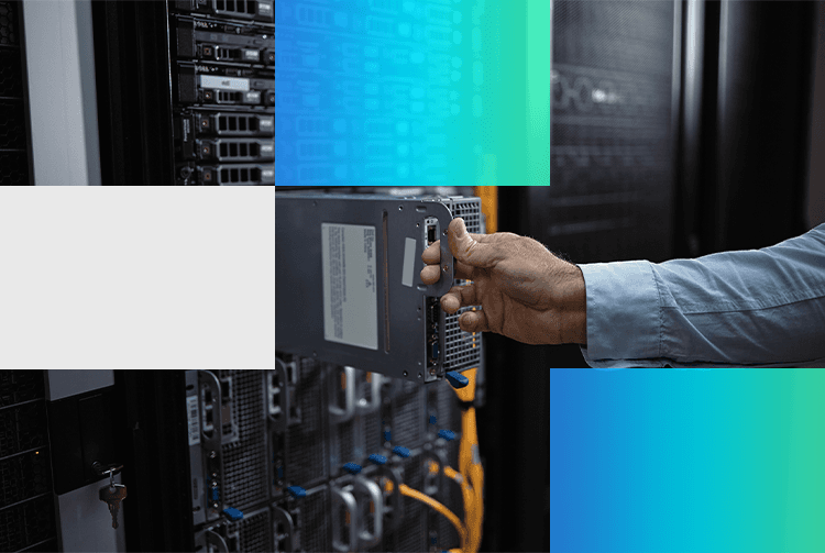 A hand inserts a drive into a rack-mounted server in a data center, with rows of servers and network cables visible.